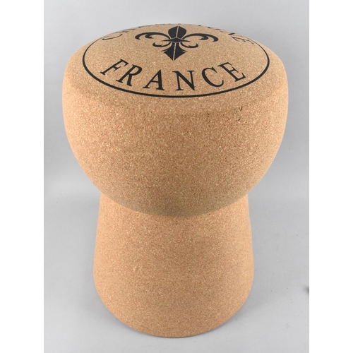 121 - A Novelty Stool in the Form of a Champagne Cork, 49cms High