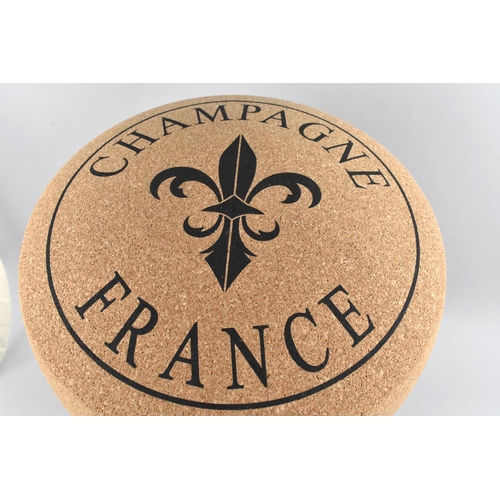 121 - A Novelty Stool in the Form of a Champagne Cork, 49cms High