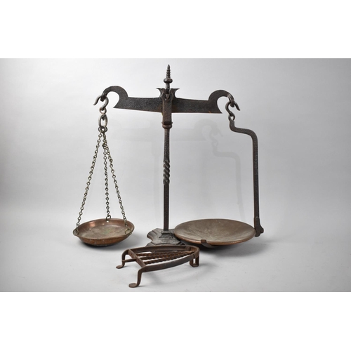 133 - A Wrought Iron Pan Scale together with a Flat Iron Stand