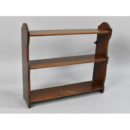 206 - An Edwardian Mahogany Wall Hanging Three Shelf Unit, 59cms Wide