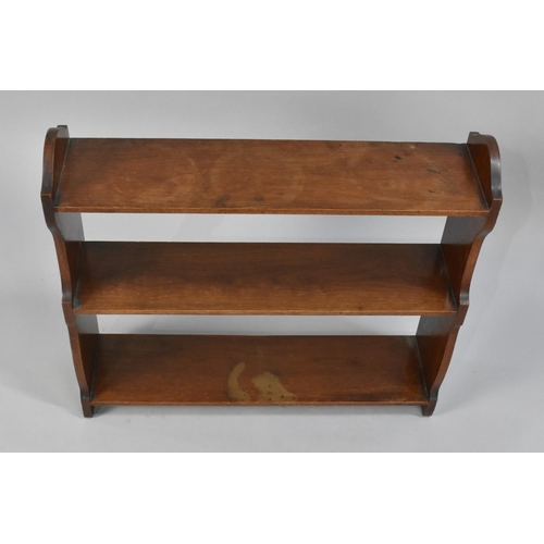 206 - An Edwardian Mahogany Wall Hanging Three Shelf Unit, 59cms Wide