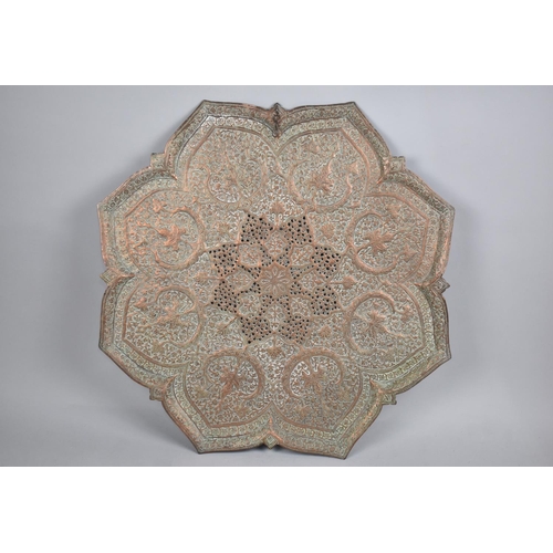 210 - A Copper Wall Hanging Islamic Charger with Relief and Pierced Decoration