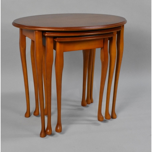 216 - A Modern Nest of Three Mahogany Oval Tables, 59cms Wide