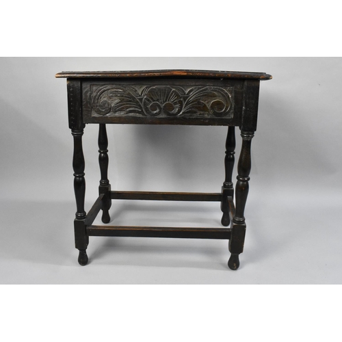 22 - A Late 19th Century Carved Oak Side Table with Single Drawer and Turned Supports, 69cms by 44cms and... 