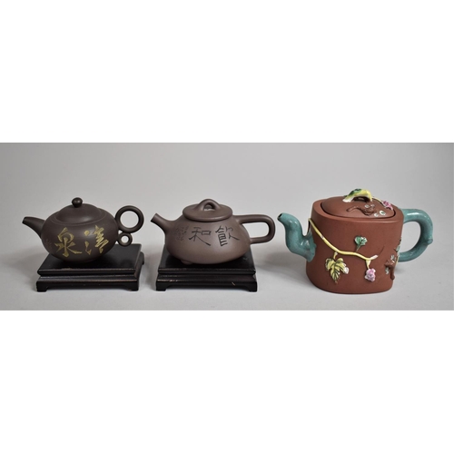 238 - A Collection of Three 20th Century Yixing Teapots, Two with Stands