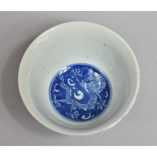 240 - A Chinese Porcelain Blue and White Tea Bowl Decorated with Dragon Chasing Flaming Pearl, Condition I... 