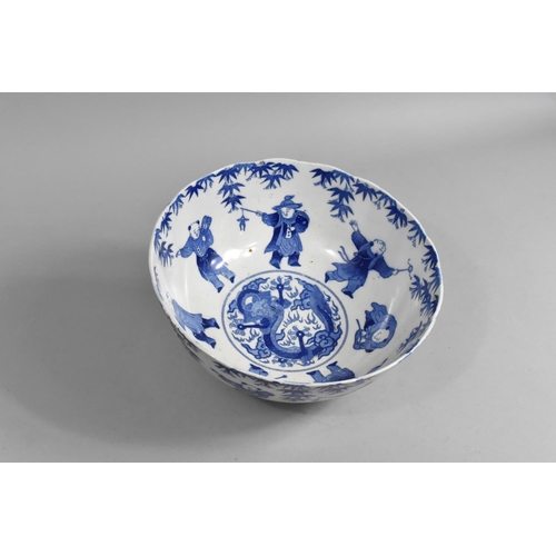 242 - A Chinese Blue and White Bowl Decorated with Figures and Central Dragon Motif, 25cm diameter