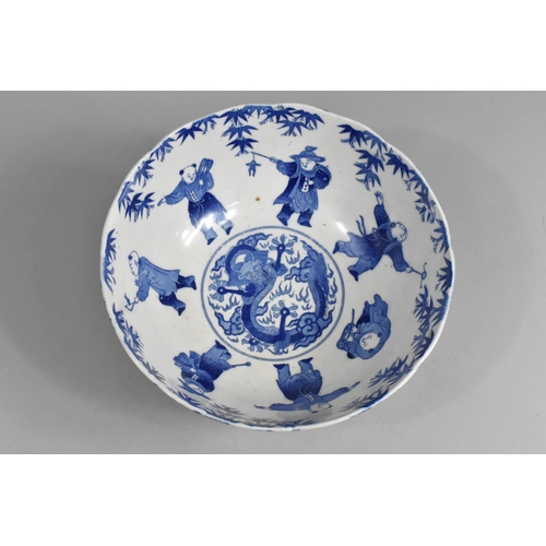 242 - A Chinese Blue and White Bowl Decorated with Figures and Central Dragon Motif, 25cm diameter