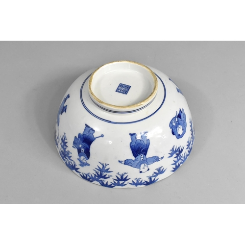 242 - A Chinese Blue and White Bowl Decorated with Figures and Central Dragon Motif, 25cm diameter