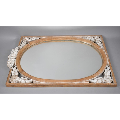 305 - A Wooden Framed Wall Mirror with Oval Glass, the Pierced Border with Floral Design, 64x43cm