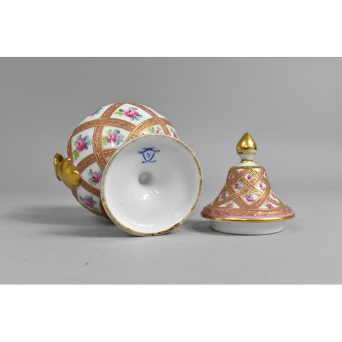 359 - A Porcelain Lidded Pedestal Vase with Twin Handles Decorated with Pink and Gilt Insets Bordering Han... 