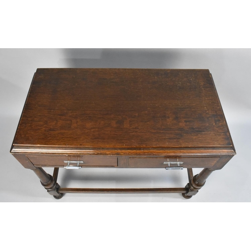 39 - An Art Deco Oak Side Table With Two Drawers and Turned Supports, 92cms Wide