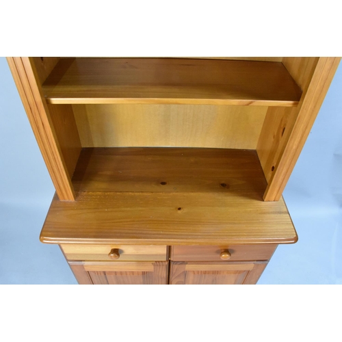 440 - A Modern Pine Bookcase with two Centre Drawers over Cupboard Base, 79cm Wide