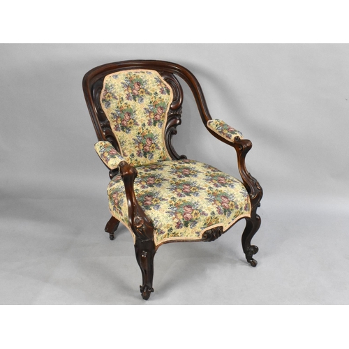 525 - A Late Victorian Mahogany Framed and Tapestry Armchair on  Scrolled Castor Supports