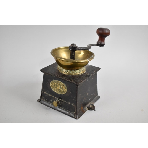 62 - A Late Victorian/Edwardian Brass Mounted Cast Iron Coffee Grinder