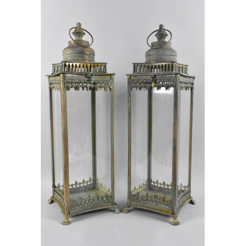 64 - A Pair of Modern Green Patinated Brass and Glass Lanterns with Hinged Lids and Claw Feet, 53cms High