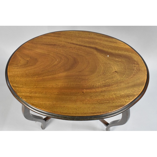 69 - An Edwardian Oval Mahogany Occasional Table on Cabriole Supports, 64cms Wide