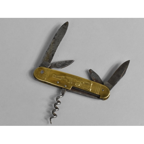 19 - A Novelty Multi Tool Penknife with Brass Scale Decorated in Relief with Gymnasts, 9.5cms Long