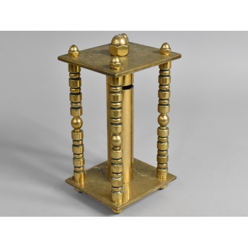 2 - An Early 20th Century Brass Coin Store of Cylindrical Form and Set in Rectangular Stand, 22cms High