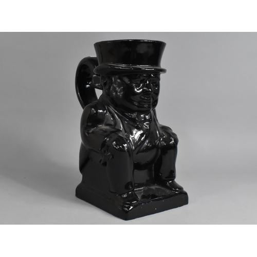 251 - A Large Black Glazed Winston Churchill Jug, 30cm high