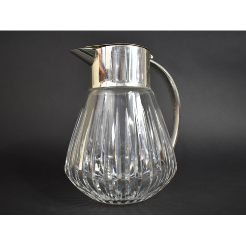 276 - A Large Heavy Glass and Silver Plated Jug with Inner Ice Chamber 23cm high