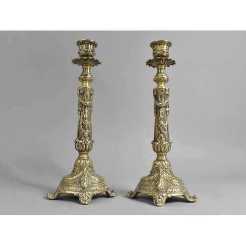 31 - A Pair of Cast Brass Candlesticks with Scrolled Feet, 27cms High
