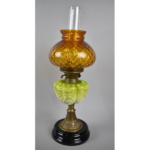 34 - A Late Victorian Oil Lamp with Brass Support, Green Ceramic Reservoir, Coloured Shade and Plain Chim... 
