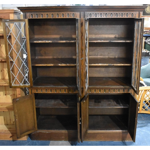 403 - A Mid 20th Century Oak Bookcase with Leaded Glazed Doors to Shelved Top Section and Cupboard Base, 1... 