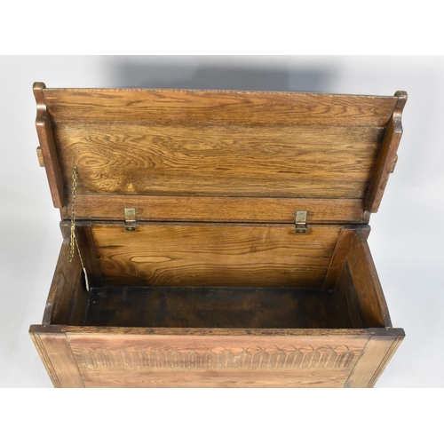 422 - A Mid 20th Century Oak Lift Top Coffer Chest by Lock of London with Carved Front Panel, 102cms Wide