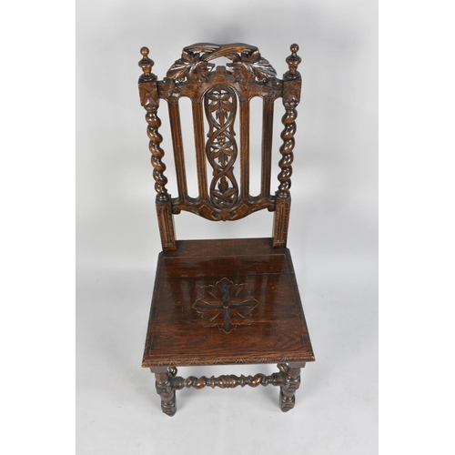 435 - An Edwardian Carved Oak Gothic Revival Hall Chair