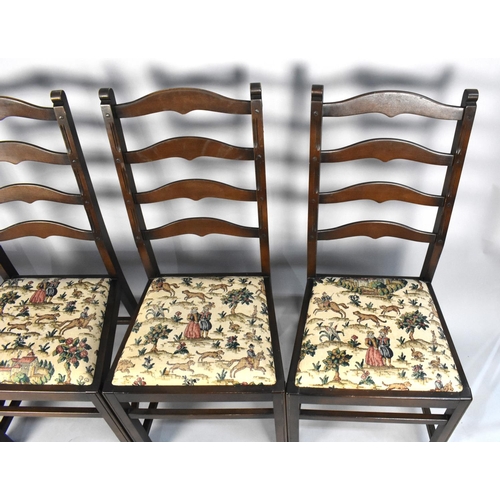 437 - A Set of Four Mid 20th Century Mahogany Ladder Back Chairs