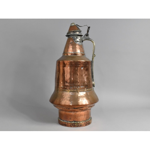 55 - A North African Arabic Copper Water Jug with Brass Handle and Lid, 48cms High