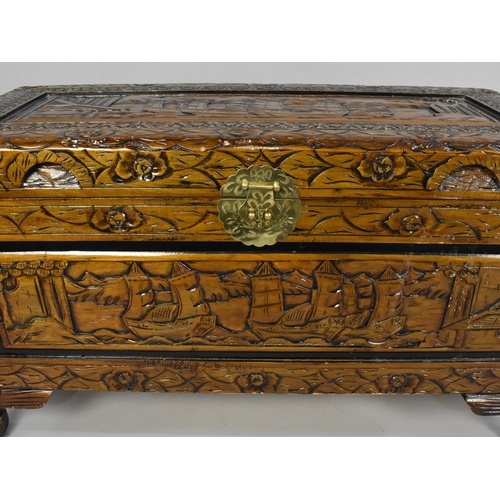 86 - A Modern Oriental Carved Camphor Wood Lift Top Chest, 87cms Wide