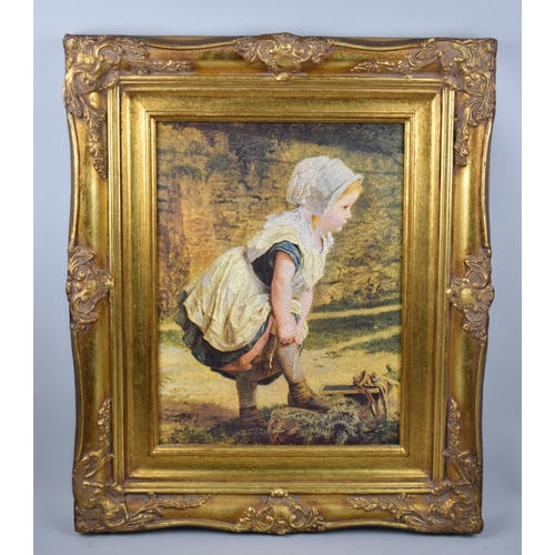 129 - A Modern Gilt Framed Print of Child Pulling Up Stockings, 29x39cms