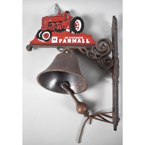 132 - A Cold Painted Cast Iron Wall Hanging Door Bell in the Form of a Farmall Tractor, 37cms High, +VAT