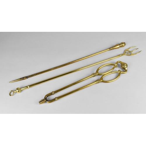 151 - A Collection of Three Long Handled Brass Fire Irons, One with Registration mark Stamp