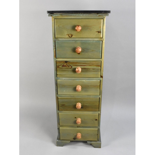 174 - A Modern Stained Pine Chest of Seven Drawers, Reconstituted Marble Top, 46cms Wide and 127cms High