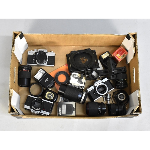 235 - A Collection of Various Camera Bodies, Telescopic Lenses, Flash Guns Etc