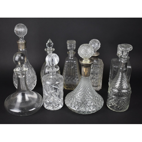 307 - A Collection of Various Glass Decanters to include Ships Decanter with Silver Plated Cuff etc