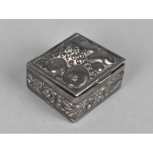 384 - A Small White Metal Box with Repousse Decoration Having Fruit to Lid, 2.5cm Square