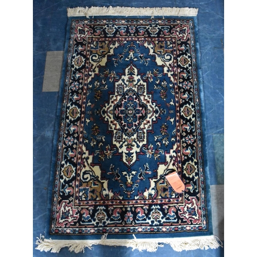 486 - A Patterned Shirvana Patterned Rug on Blue Ground, 147x91cms