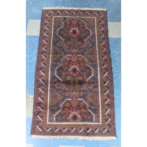 487 - A Vintage Bokhara Type Pattern Rug on Burgundy Ground, 194x104cm