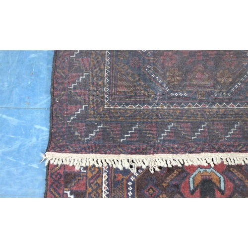 487 - A Vintage Bokhara Type Pattern Rug on Burgundy Ground, 194x104cm