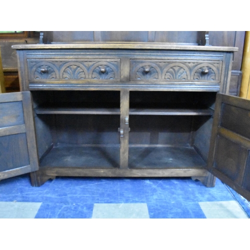 489 - A Mid 20th Century Oak Dresser with Two Drawers, Cupboard Base, Raised Shelf Plate Rack, 122cms Wide