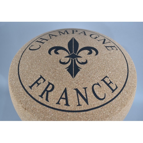 69 - A Novelty Stool in the Form of a Champagne Cork, 34cms Diameter and 48cms High