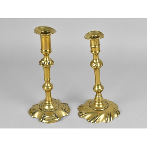 85 - A Pair of Georgian Brass Candlesticks with Pushers, Candleholders Somewhat Distorted, 23cms High