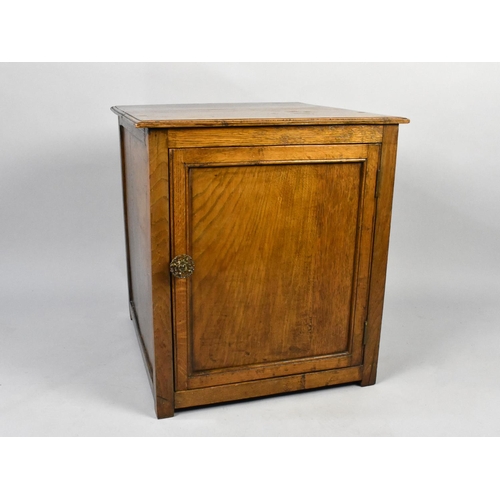 101 - A Mid 20th Century Oak Cabinet with Panelled Door to Shelved Interior, 51cms by 53cms by 57cms High