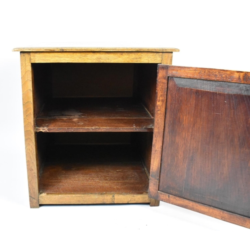 101 - A Mid 20th Century Oak Cabinet with Panelled Door to Shelved Interior, 51cms by 53cms by 57cms High