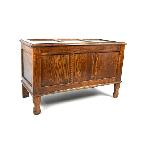 136 - A Mid 20th Century Oak Lift Top Coffer with Three Panel Front, 91cms Wide