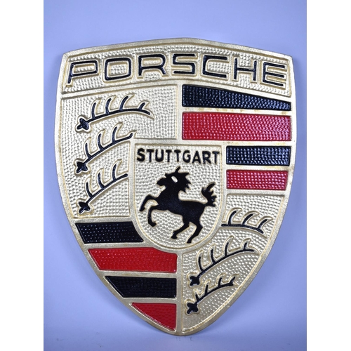 138 - A Large Cold Painted Aluminium Shield for Porsche Motorcars. 56cms High Plus VAT